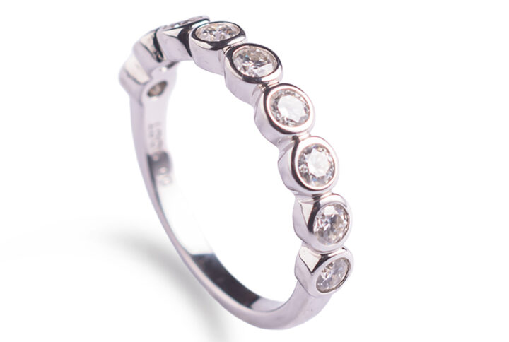 Elegant half-band ring with sparkling Moissanite stones Timeless rhodium-plated sterling silver ring with 0.9ct Moissanite