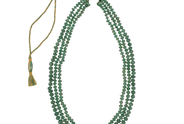 Noor Necklace: A Timeless Statement of Elegance Three graceful layers of green strawberry quartz, each carved in a delicate pumpkin shape, come together in this 34-inch masterpiece. Adjustable with a soft silk string for a perfect fit, this necklace blends sophistication with versatility, making it your go-to piece for any occasion.